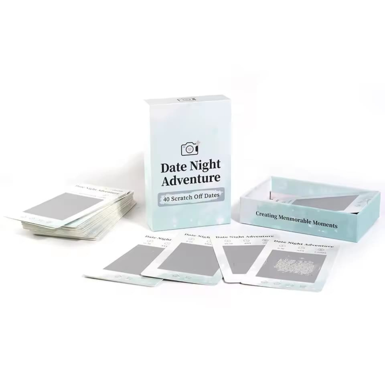 A hand scratching off a section of the Datenight adventure (scratch) card to reveal an activity.